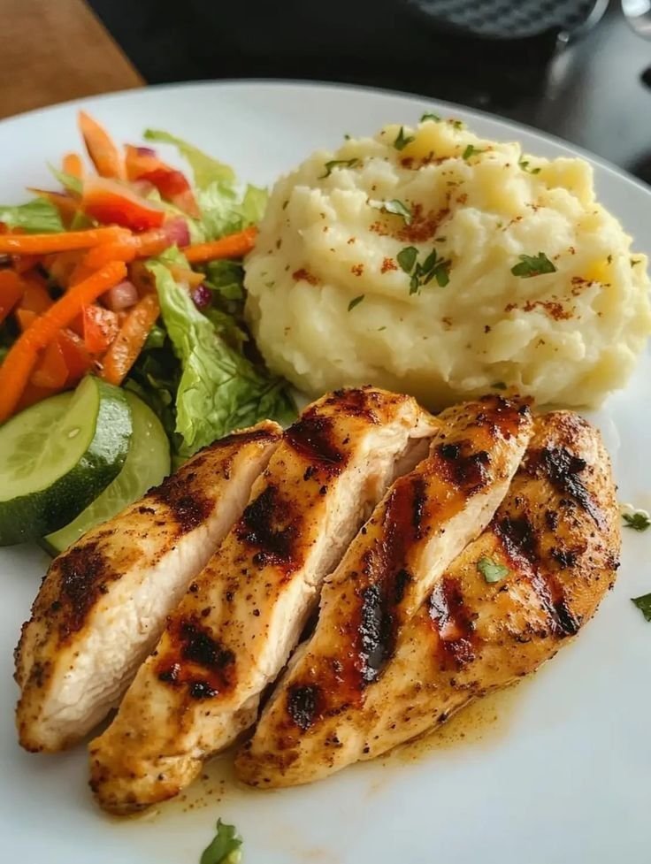 Healthy grilled chicken, vegetables and sweet potato meal representing Cristiano Ronaldo diet plan]